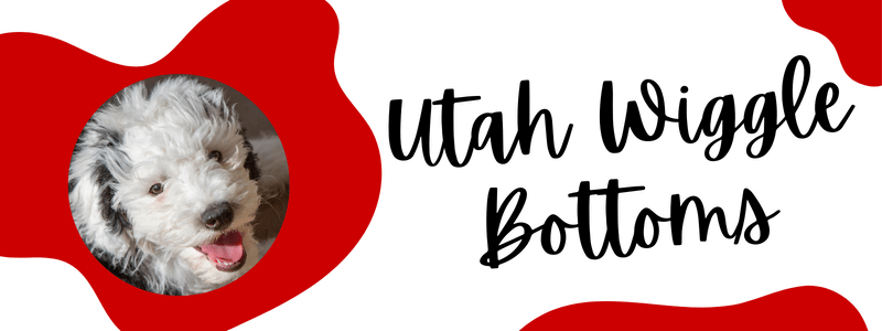 Crimson red and white decorative banner with a Sheepadoodle dog and text saying "Utah Wiggle Bottoms".