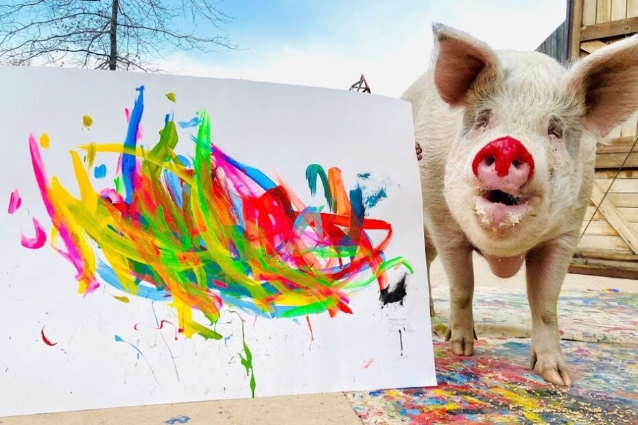 A pig stands next to a large canvas featuring colorful abstract paint strokes outdoors near wooden structures.